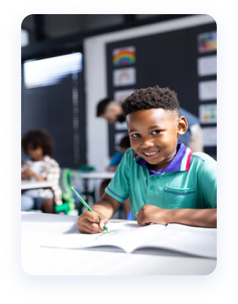 A young learner reading and exploring a book.